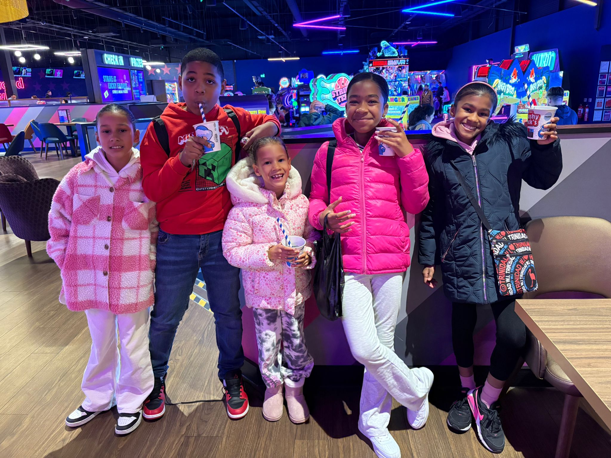 Group of children on a bowling and arcade trip