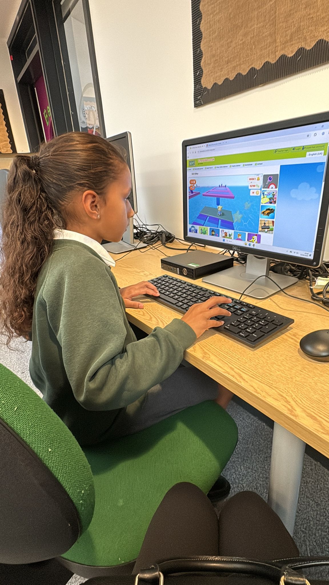 Child using a computer during a learning session