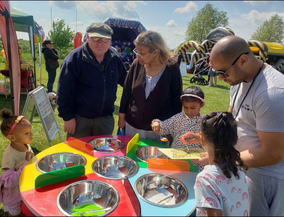Family playing a game together at a fun day
