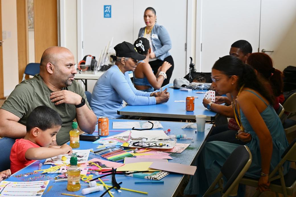 Families taking part in table activities during the Father’s Day Family Social