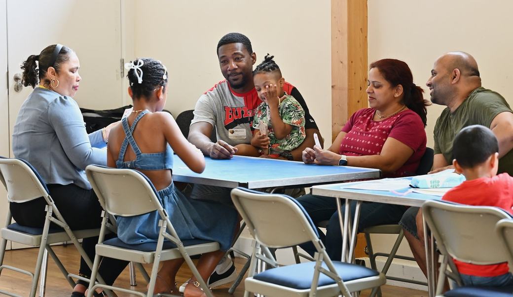 Families sitting around tables during the Father’s Day Family Social
