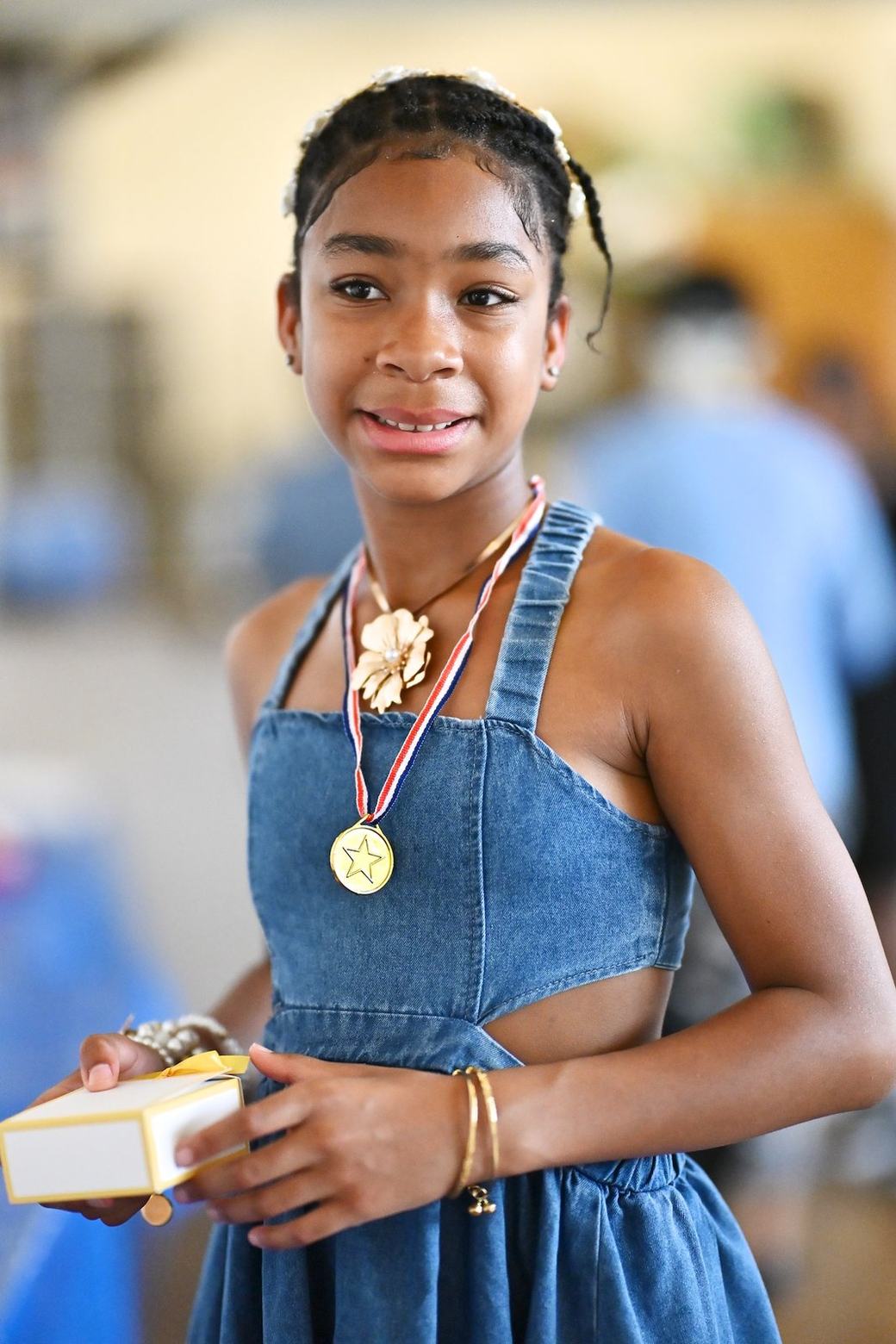 Young attendee with event recognition item at the Father’s Day Family Social