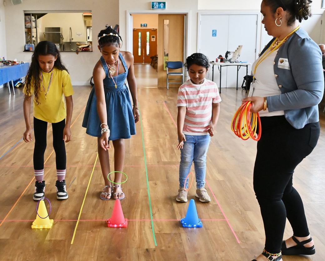 Children preparing for a ring toss activity